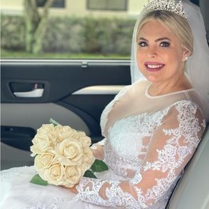 I am selling a wedding dress that I wore only for 4 hours.